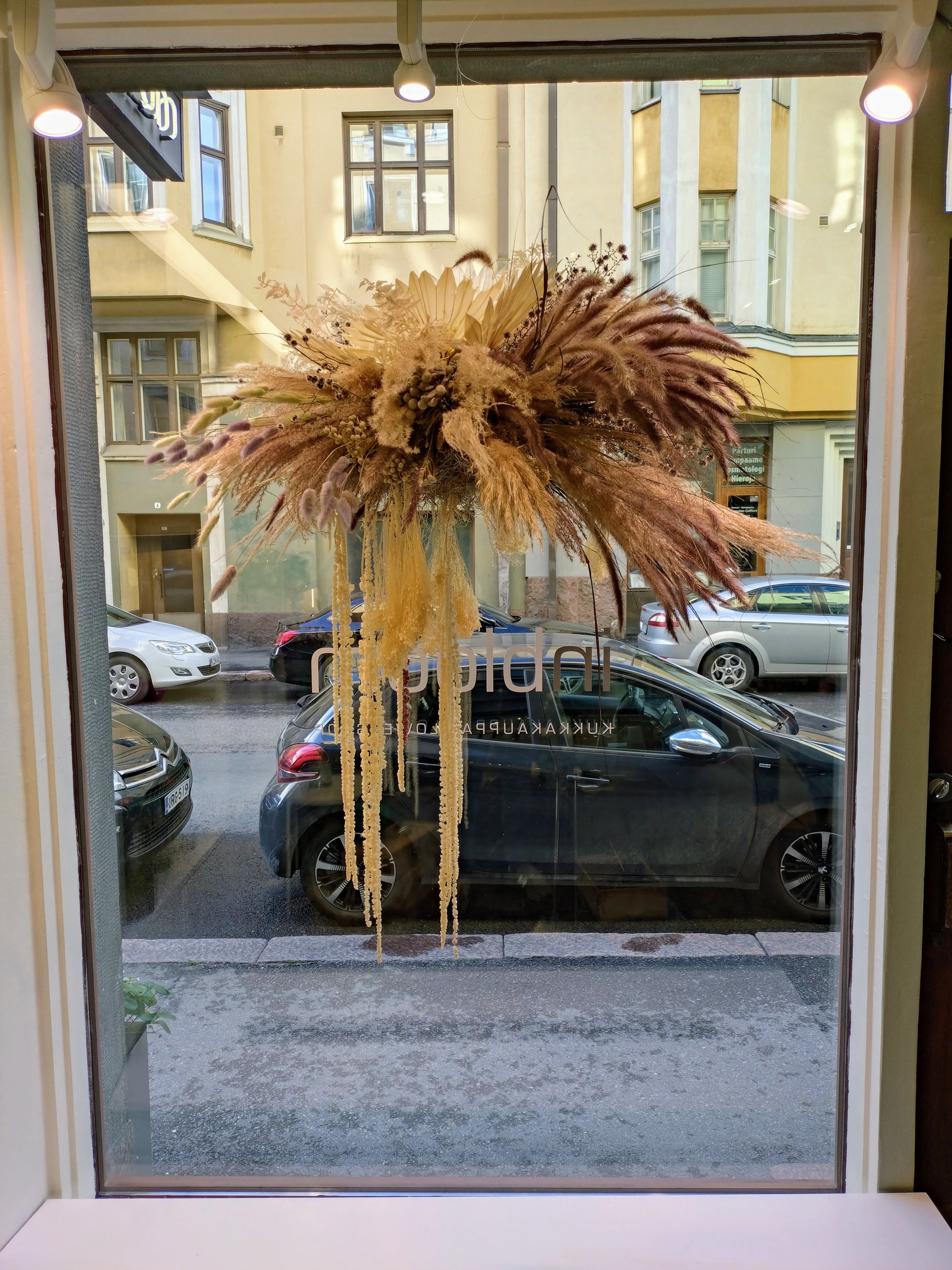 Dried Flower Cloud hanging in window at inbloom shop